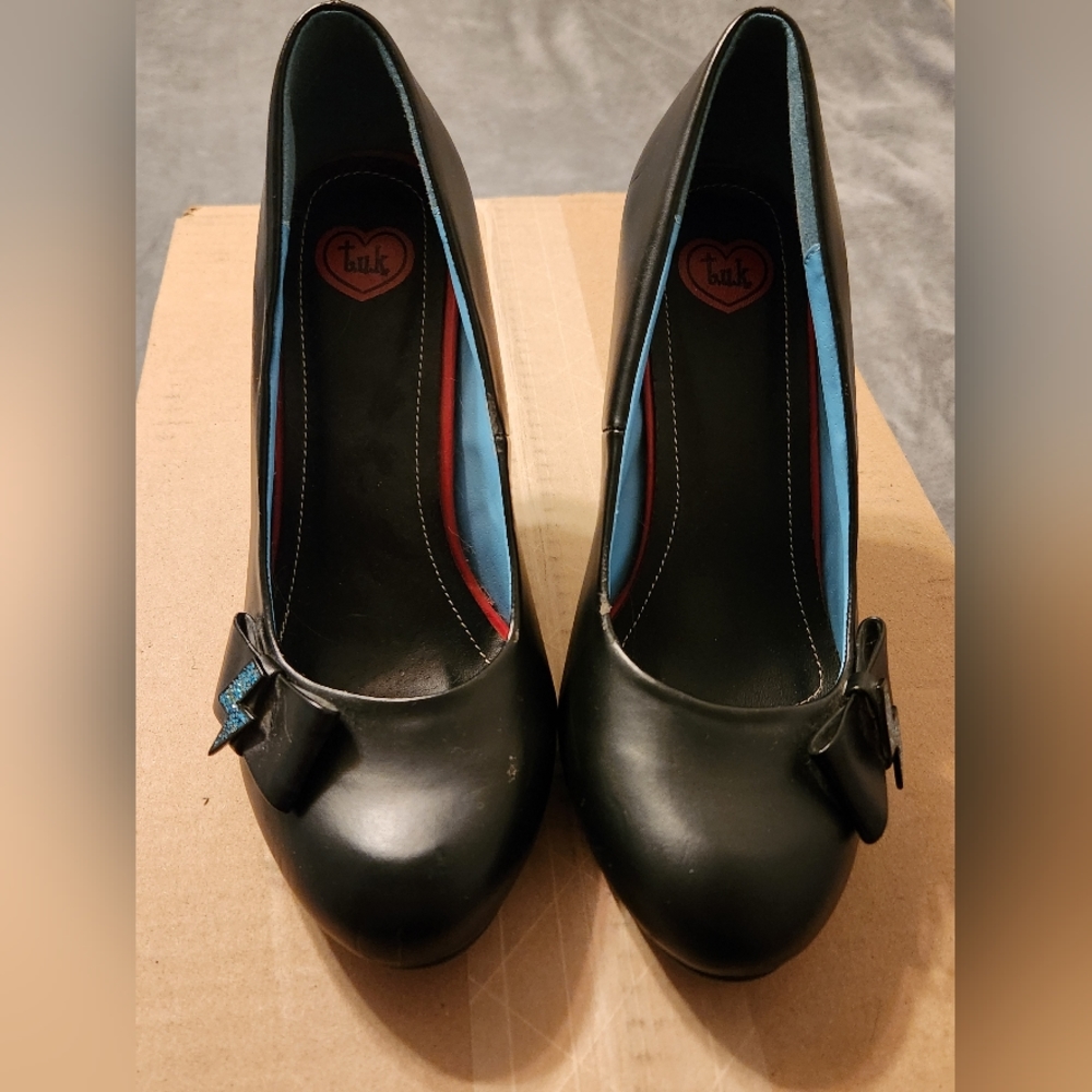 Black TUK heels with lightning bolt details